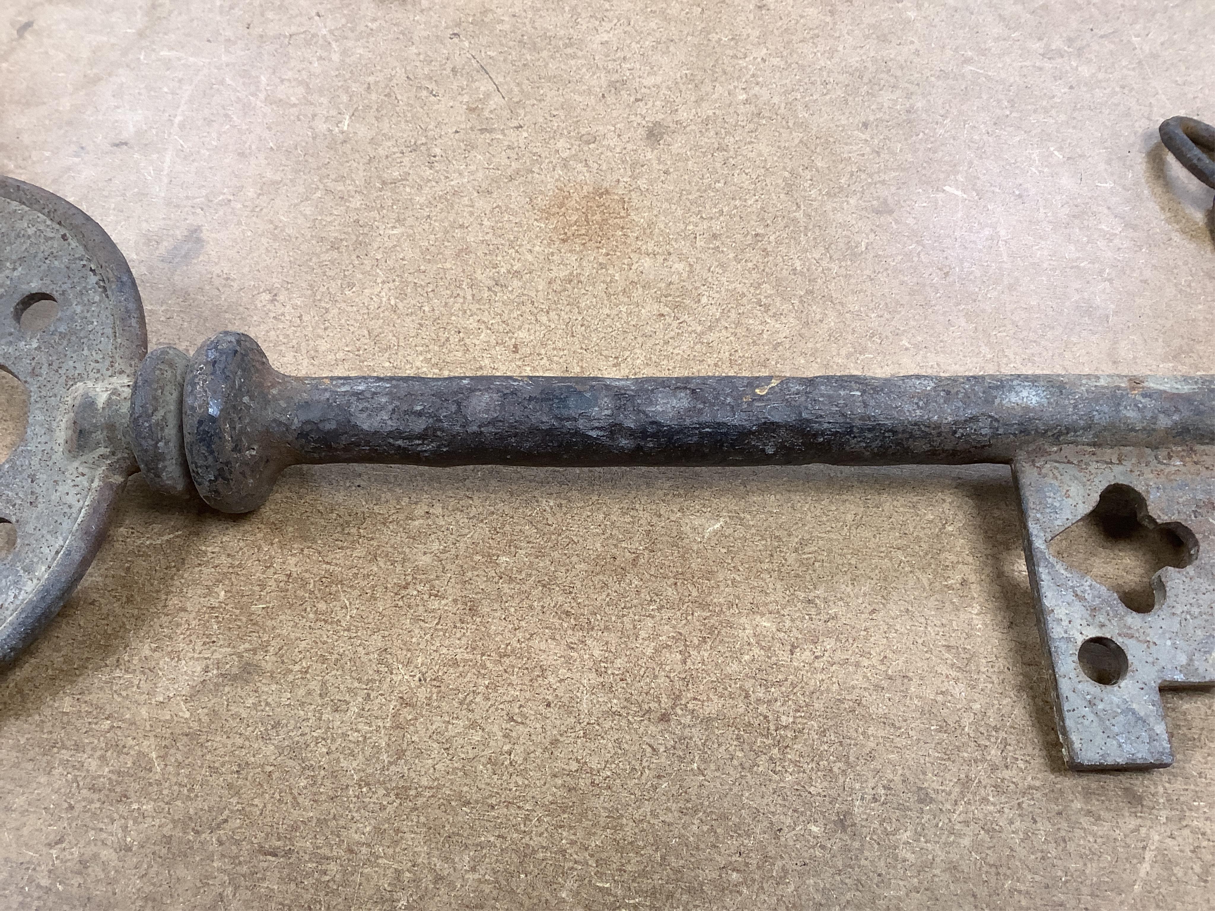 An oversized cast iron shop sign advertising key, 50cm wide. Condition - fair